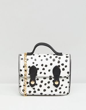 Petit cartable à pois avec poignée sur le dessus